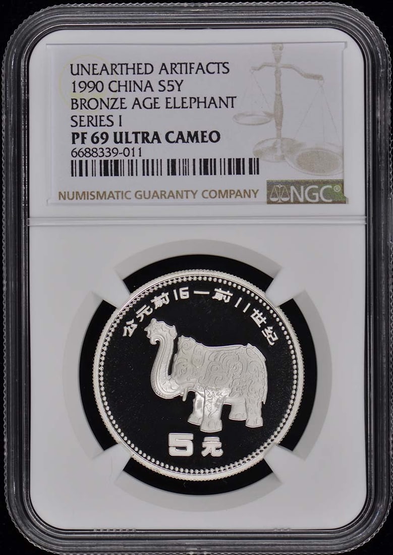 1990 China Bronze Elephant Coin NGC PR69DCAM Uncirculated: 1990 China Bronze Elephant Coin NGC PR69DCAM Uncirculated This stunning 1990 China Bronze Age Elephant coin is graded PR69 by NGC, indicating its exceptional quality. The coin remains uncirculated, sh