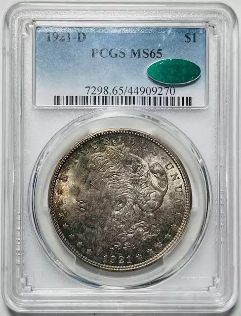 1921 D Morgan Silver Dollar PCGS MS65 CAC Uncirculated: 1921 D Morgan Silver Dollar PCGS MS65 CAC Uncirculated This 1921 D Morgan Silver Dollar features a stunning uncirculated grade of MS 65, certified by both PCGS and CAC for its quality and authenticity
