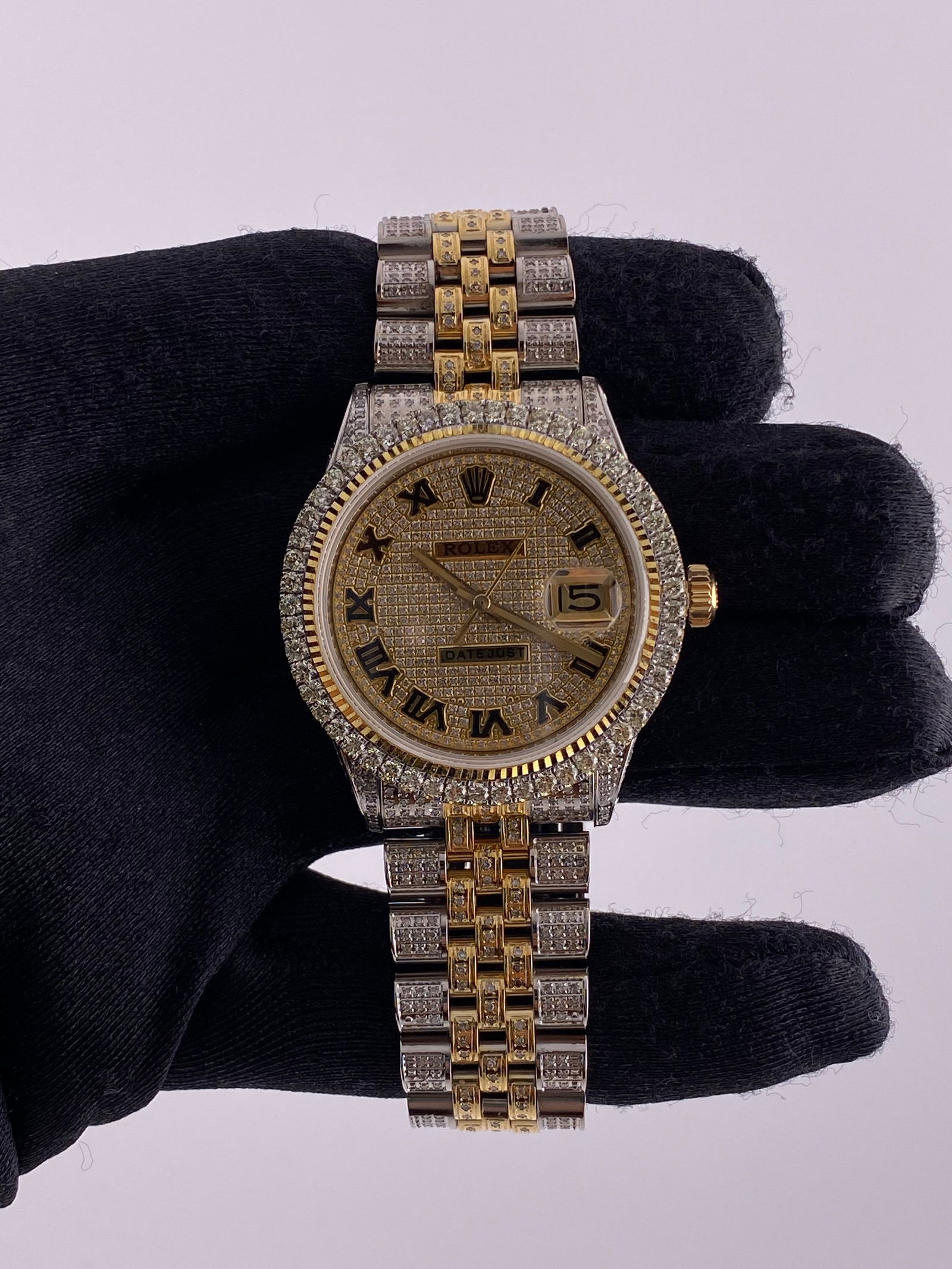 Datejust Reference 1601 Diamond Dial Mens Watch with Aftermarket Jubilee: Datejust Reference 1601 Diamond Dial Mens Watch with Aftermarket Jubilee This Rolex Datejust features a diamond Roman numeral dial, a diamond bezel, and an aftermarket Jubilee bracelet. The watch is d