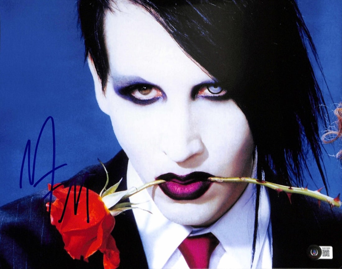 Marilyn Manson Signed 11x14 Photo with Beckett Certification: Marilyn Manson Signed 11x14 Photo with Beckett Certification This is an original autographed 11x14 photograph of Marilyn Manson, signed in blue permanent marker. The signature has been authenticated b