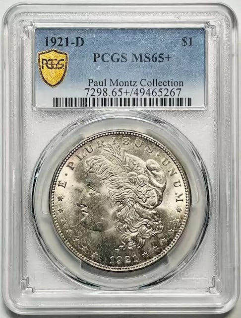 1921 D Morgan Silver Dollar PCGS MS-65+ Paul Montz Collection: 1921 D Morgan Silver Dollar PCGS MS-65+ Paul Montz Collection This 1921 D Morgan Silver Dollar is a stunning piece from the Paul Montz Collection, featuring a high grade of MS 65+ as certified by PCGS