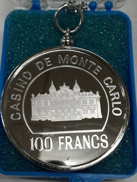 Sterling Silver Monte Carlo Casino 100 Franc Proof Medal in Bezel with Chain: Sterling Silver Monte Carlo Casino 100 Franc Proof Medal in Bezel with Chain This Monte Carlo Casino 100 Franc sterling silver proof medal is set in a bezel and comes with a matching chain, creating a