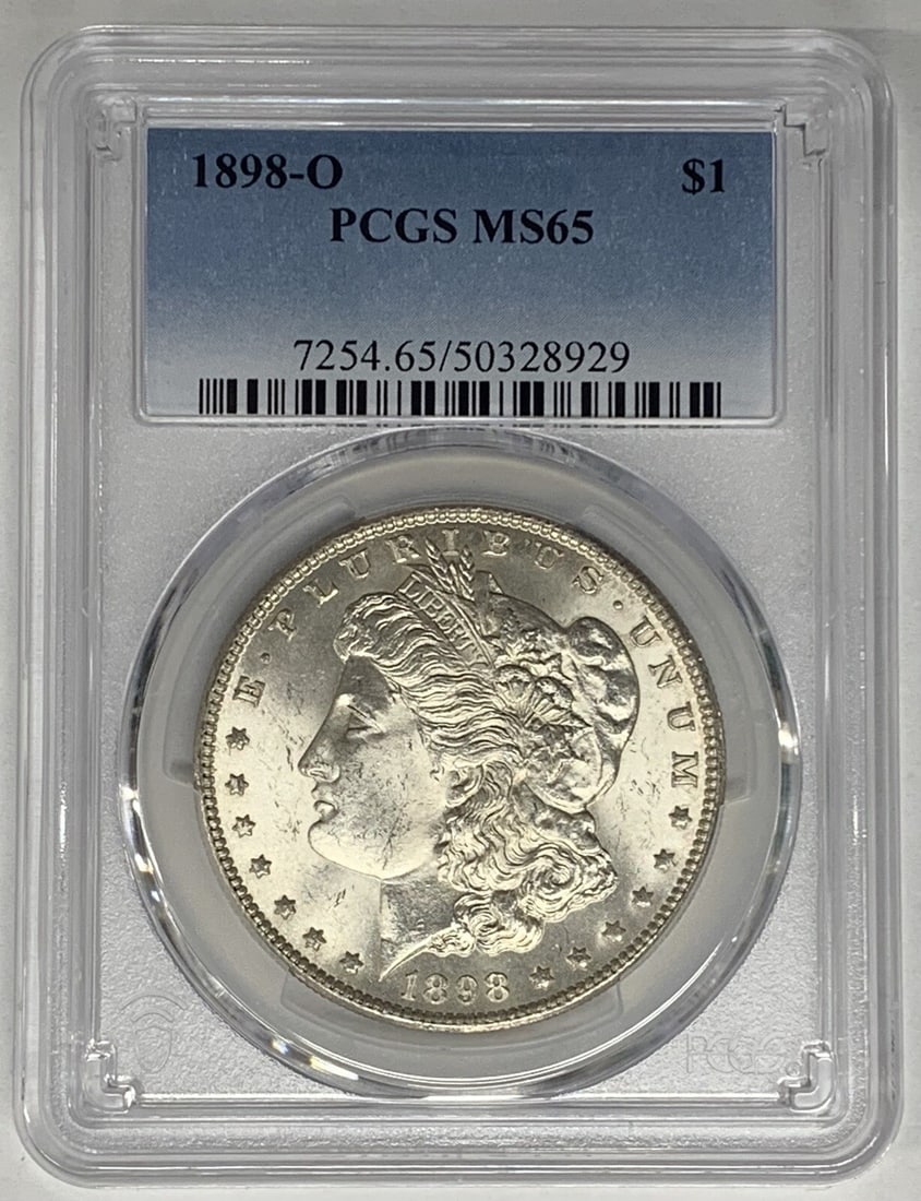 PCGS MS65 1898-O Morgan Dollar Silver Coin United States: PCGS MS65 1898-O Morgan Dollar Silver Coin United States This is a 1898-O Morgan Silver Dollar featuring a denomination of $1. The coin is composed of silver and has been graded MS 65 by PCGS, confirm