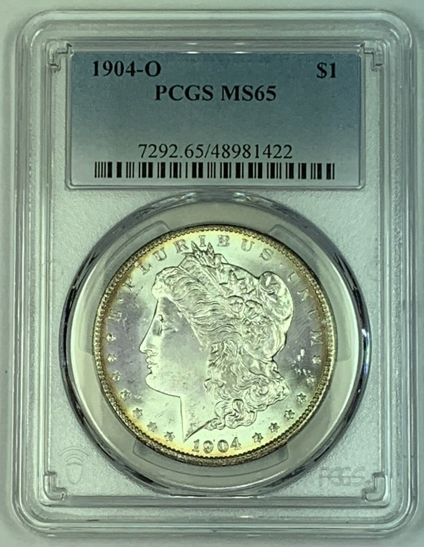 PCGS MS 65 1904-O Morgan Silver Dollar Uncirculated Coin: PCGS MS 65 1904-O Morgan Silver Dollar Uncirculated Coin This 1904-O Morgan Silver Dollar features a PCGS grade of MS 65, indicating its uncirculated condition. Minted in the United States, this coin