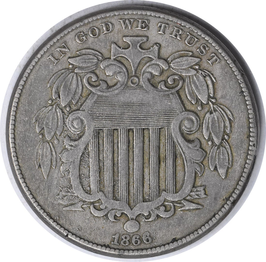 1866 Shield Nickel 5C VF Uncertified Philadelphia Mint by Longacre: 1866 Shield Nickel 5C VF Uncertified Philadelphia Mint by Longacre This 1866 Shield Nickel features a pitted obverse die and is graded as Very Fine (VF). It is a circulated coin from the Philadelphia