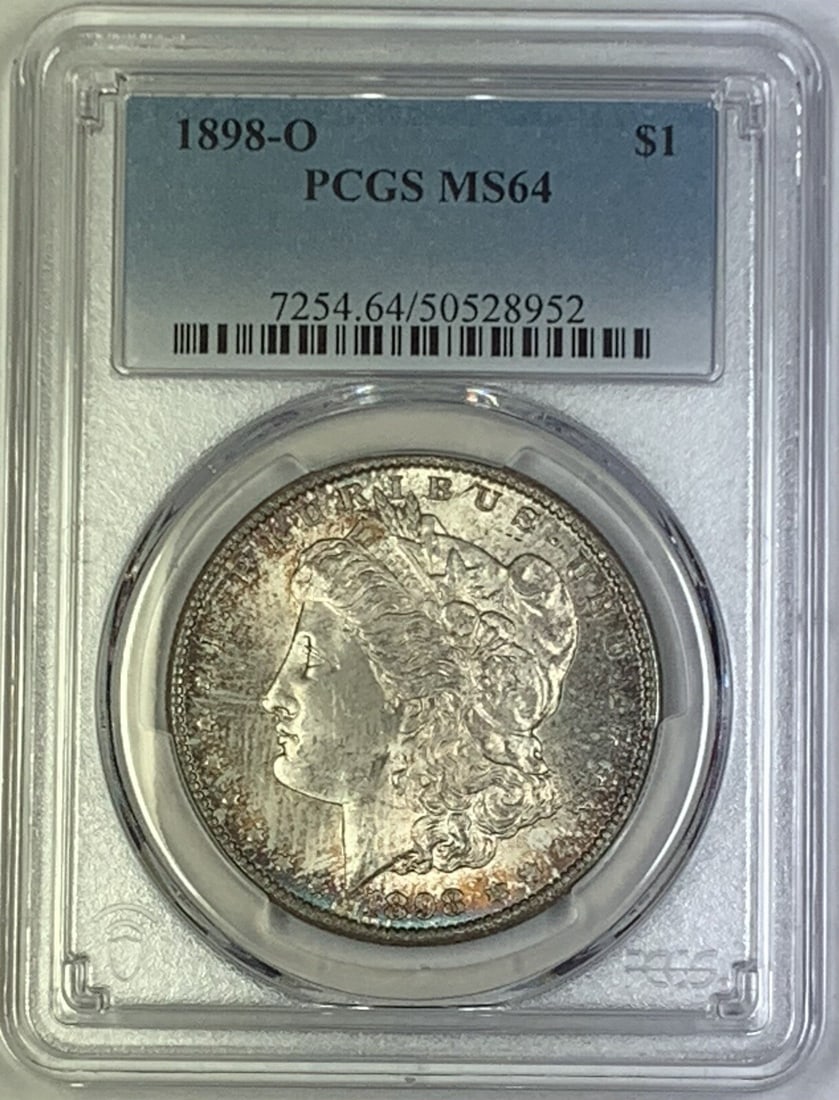 PCGS MS 64 1898-O Toned Morgan Dollar Silver United States: PCGS MS 64 1898-O Toned Morgan Dollar Silver United States This is a 1898-O Morgan Silver Dollar featuring attractive toning and graded MS 64 by PCGS. The coin is uncirculated and composed of silver,