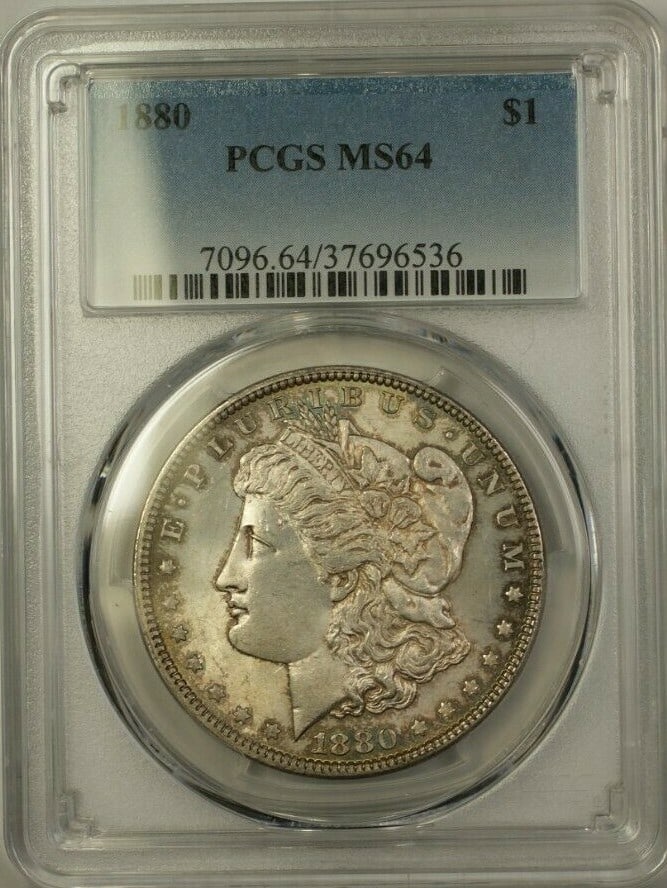 PCGS MS-64 1880 Morgan Dollar Silver Coin with Toning: PCGS MS-64 1880 Morgan Dollar Silver Coin with Toning This 1880 Morgan Silver Dollar coin is graded MS-64 by PCGS and features attractive toning. Minted in Philadelphia, it is composed of silver, has