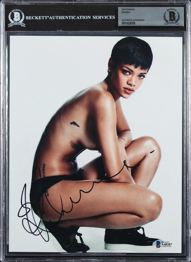 Rihanna Signed 8x10 Photo Autographed Beckett Slabbed: Rihanna Signed 8x10 Photo Autographed Beckett Slabbed This captivating 8x10 photograph features a sultry pose of Rihanna, personally signed by the artist herself. The autograph is authenticated by Bec