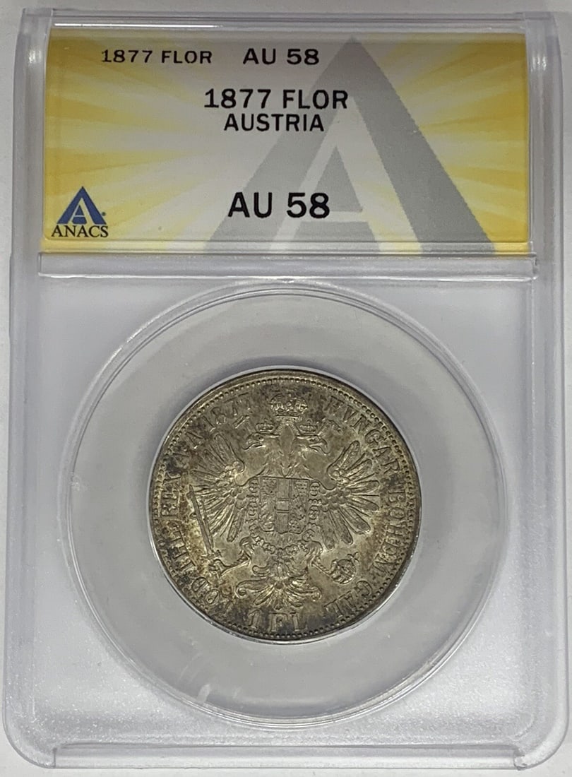 Silver 1877 Austria 1 Florin ANACS Certified AU 58 Coin: Silver 1877 Austria 1 Florin ANACS Certified AU 58 Coin This 1877 Austria 1 Florin coin is composed of silver and has been graded AU 58 by ANACS, indicating a well-preserved pre-owned condition. It is