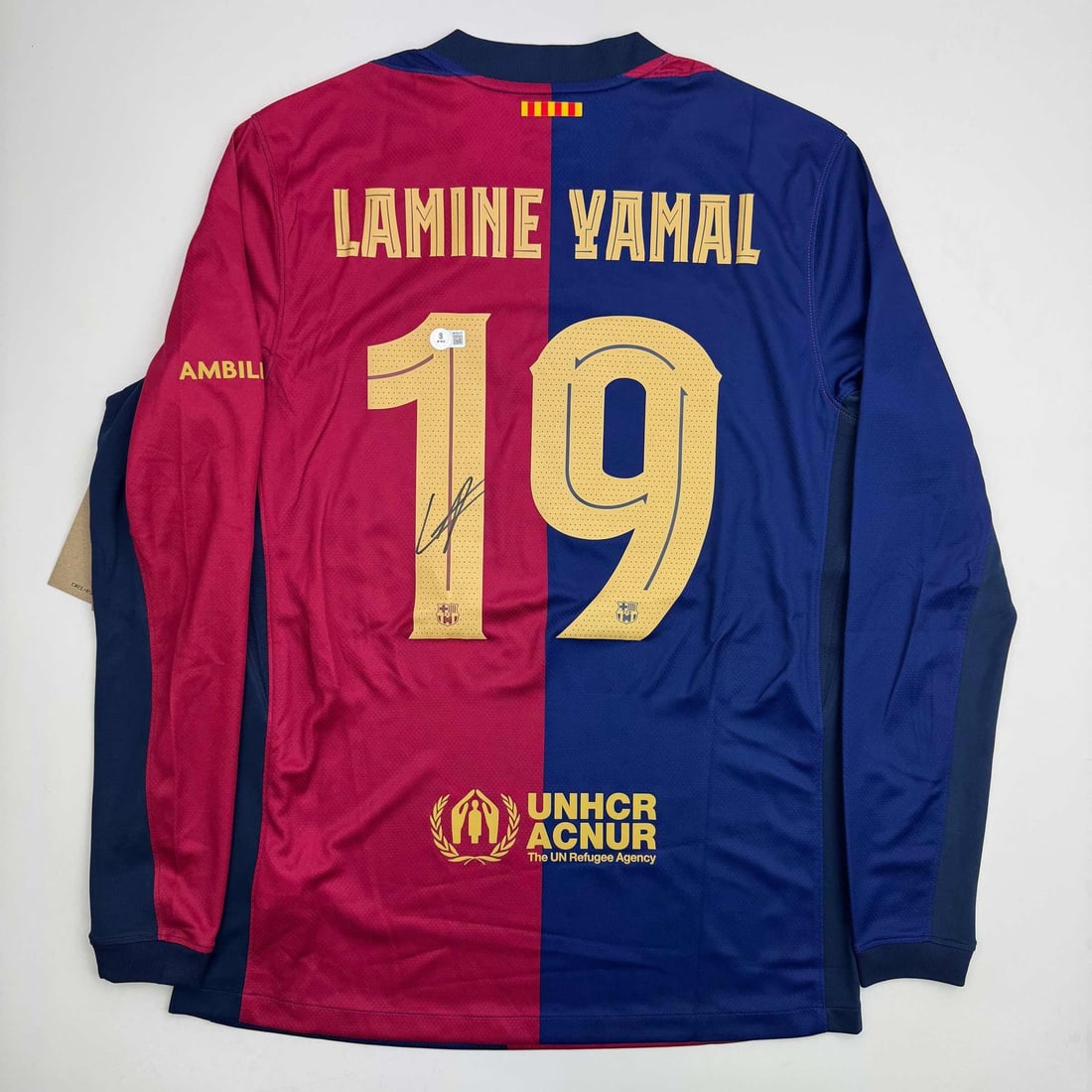 Lamine Yamal Autographed FC Barcelona Soccer Jersey Beckett COA: Lamine Yamal Autographed FC Barcelona Soccer Jersey Beckett COA This is an autographed blue soccer jersey of Lamine Yamal, a talented player from FC Barcelona. The jersey features Yamal's name and num