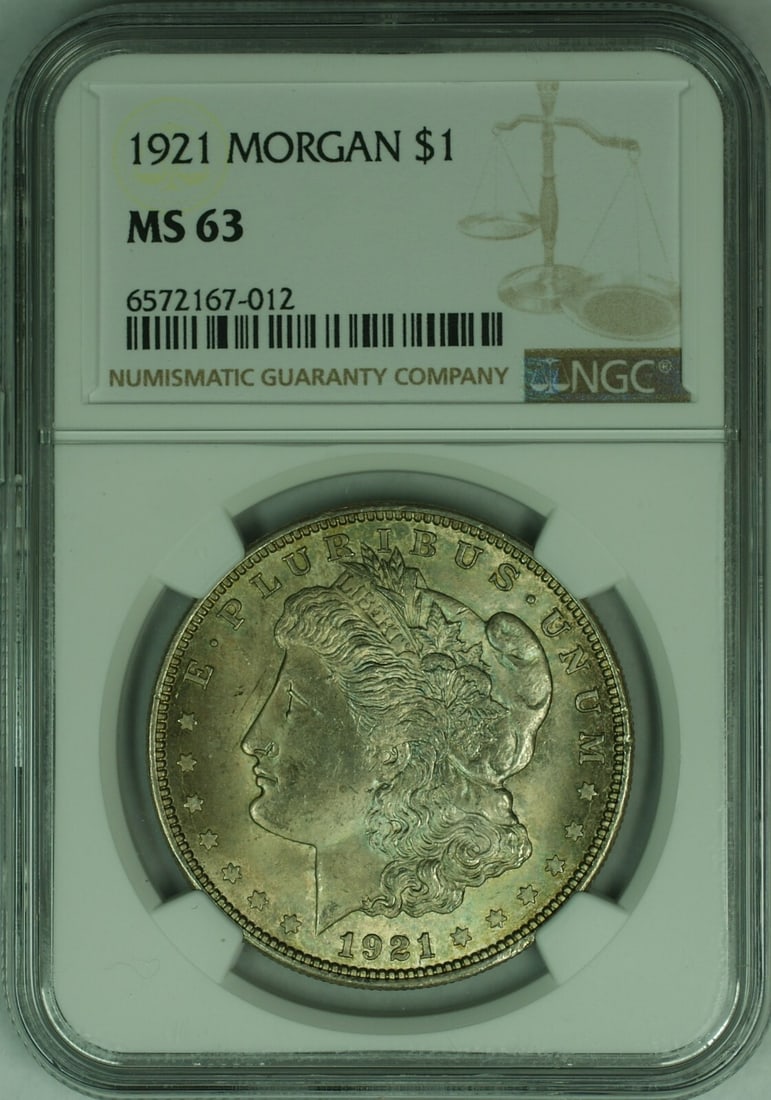 1921 $1 Morgan Dollar NGC MS-63 Silver Coin With Toning: 1921 $1 Morgan Dollar NGC MS-63 Silver Coin With Toning This 1921 Morgan Silver Dollar $1 coin has been certified by NGC with a grade of MS-63 and features attractive toning. Struck in Philadelphia, t