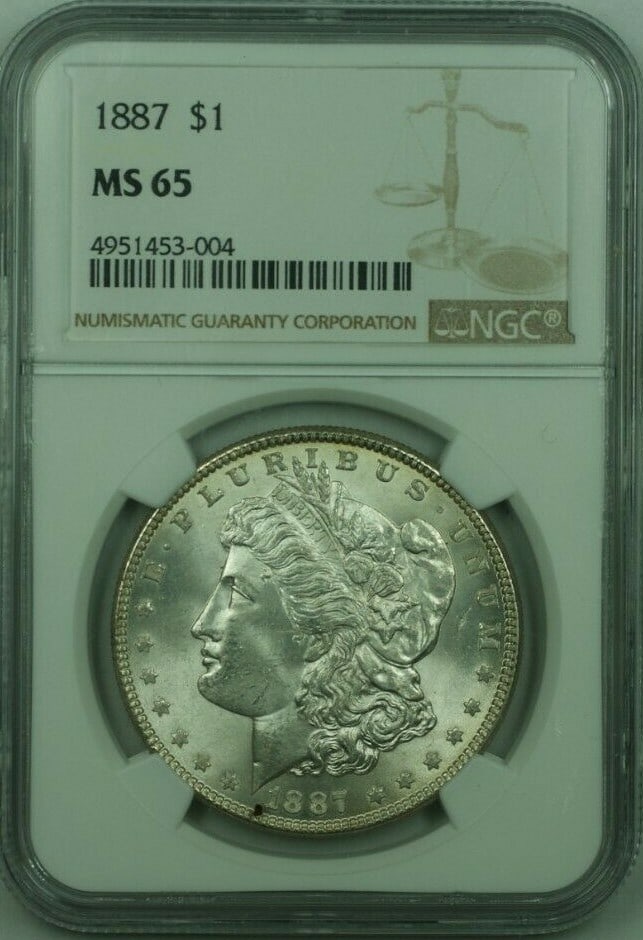 NGC MS65 Graded 1887 Morgan Dollar Silver Coin from Philadelphia Mint: NGC MS65 Graded 1887 Morgan Dollar Silver Coin from Philadelphia Mint This 1887 Morgan Silver Dollar is an uncirculated $1 coin from the United States, certified by NGC with a grade of MS-65. It is co