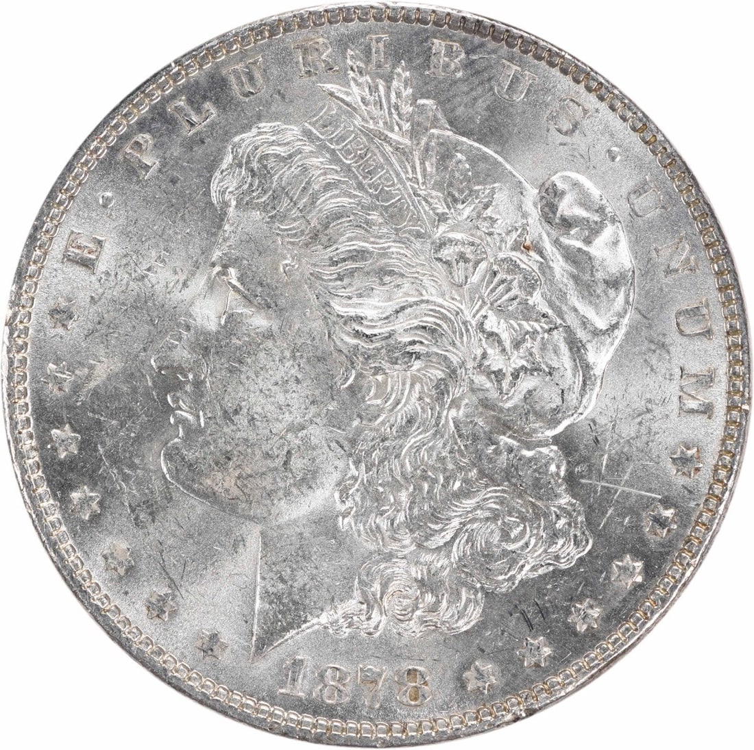 Uncirculated 1878 Morgan Dollar 7 Tail Feathers Reverse Silver Coin: Uncirculated 1878 Morgan Dollar 7 Tail Feathers Reverse Silver Coin This is a pre-owned 1878 Morgan Silver Dollar featuring the 7 Tail Feathers Reverse of 1878 design. The coin is in uncirculated cond