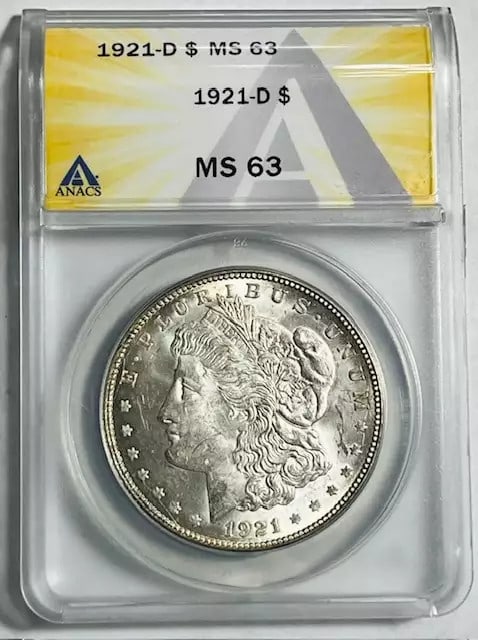 1921 D Morgan Silver Dollar ANACS MS 63 Uncirculated Coin: 1921 D Morgan Silver Dollar ANACS MS 63 Uncirculated Coin This stunning 1921 D Morgan Silver Dollar is certified by ANACS with a grade of MS 63, indicating it is in uncirculated condition. Minted in D