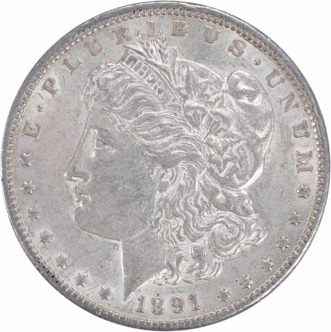 1891-CC Morgan Silver Dollar AU Uncertified Coin by George T. Morgan: 1891-CC Morgan Silver Dollar AU Uncertified Coin by George T. Morgan This 1891-CC Morgan Silver Dollar is a remarkable example of historic coinage, featuring the iconic design by George T. Morgan. The
