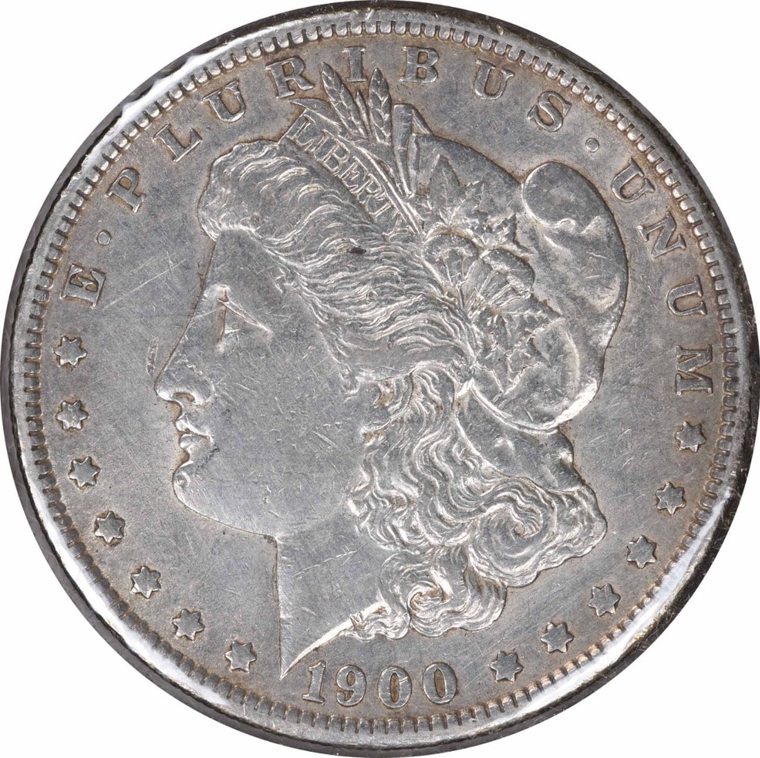 1900-O Morgan Silver Dollar AU Uncertified 90% Silver Coin: 1900-O Morgan Silver Dollar AU Uncertified 90% Silver Coin This 1900-O/CC Morgan Silver Dollar showcases a beautiful design by George T. Morgan. It is in AU condition, indicating minimal wear from cir