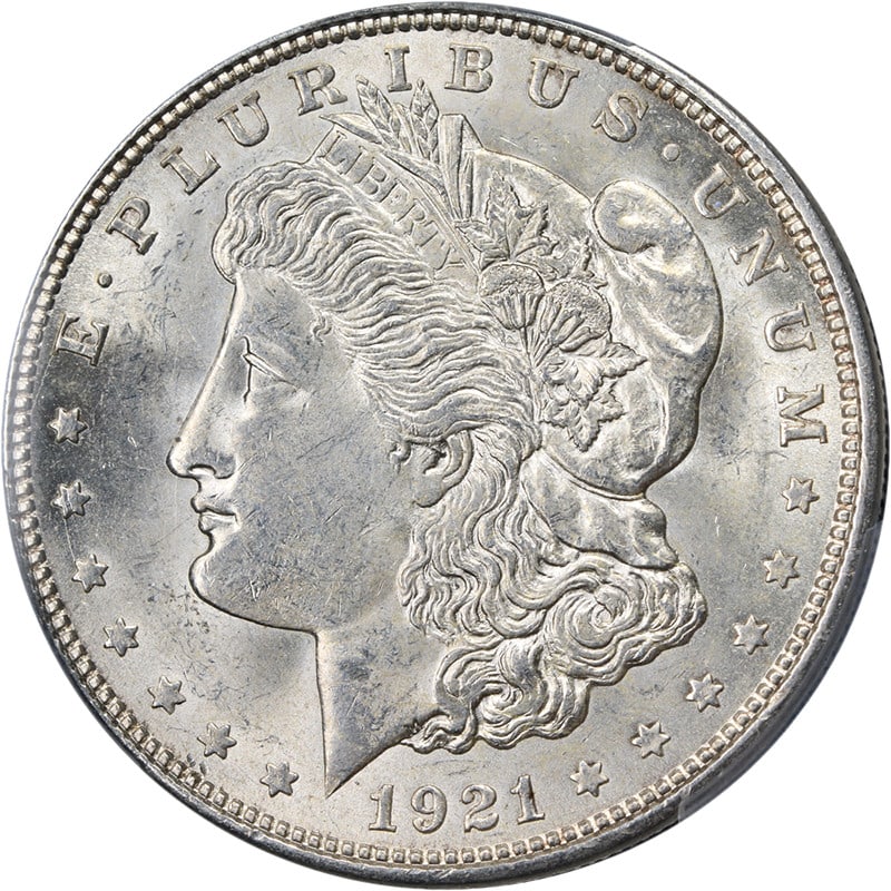 PCGS MS63 1921-D Morgan Silver Dollar with Strong Strike and Luster: PCGS MS63 1921-D Morgan Silver Dollar with Strong Strike and Luster This original 1921-D Morgan Silver Dollar is certified by PCGS with a grade of MS63, indicating it is uncirculated and in excellent