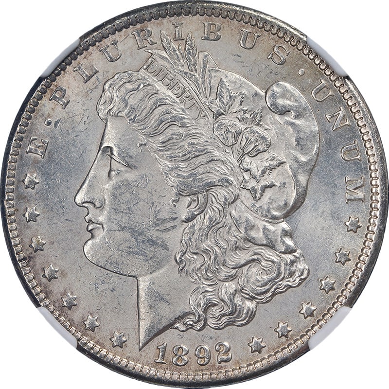 NGC MS61 1892 Carson City Morgan Silver Dollar with Eye Appeal: NGC MS61 1892 Carson City Morgan Silver Dollar with Eye Appeal This original 1892-CC Morgan Silver Dollar is graded NGC MS61, featuring attractive luster and a well-defined strike. The coin displays m
