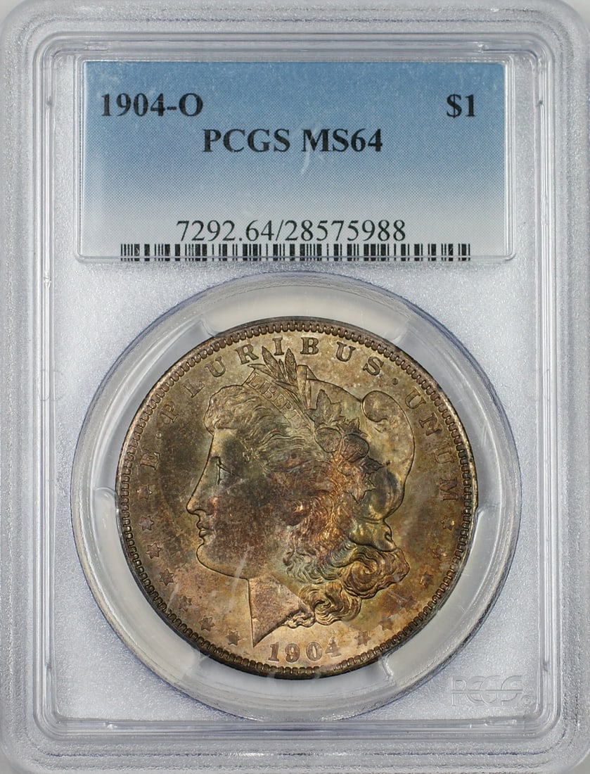 PCGS MS-64 1904-O Morgan Dollar Silver Coin with Toned Obverse: PCGS MS-64 1904-O Morgan Dollar Silver Coin with Toned Obverse This 1904-O Morgan Silver Dollar is certified by PCGS with a grade of MS-64, indicating high quality and uncirculated condition. The coin