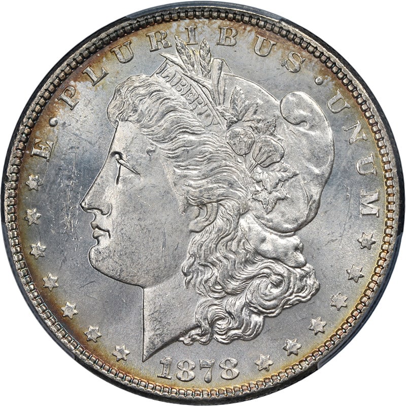 PCGS MS63 1878 Philadelphia Morgan Dollar 7 Tail Feathers Reverse 78: PCGS MS63 1878 Philadelphia Morgan Dollar 7 Tail Feathers Reverse 78 This 1878-P 7 Tail Feathers Reverse of 1878 Morgan Silver Dollar is PCGS certified MS63, indicating an uncirculated coin with super