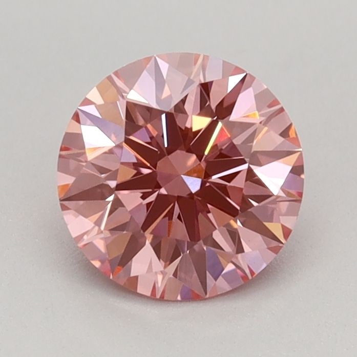 Ideal Loose Diamond - ROUND 0.72ct Fancy Vivid Pink VVS2: Ideal Loose Diamond - ROUND 0.72ct Fancy Vivid Pink VVS2 Source: This is a real non-mined Diamond that has been grown in a lab Shape: ROUND Carats: 0.72 Color: Fancy Vivid Pink Certification: IGI Vide