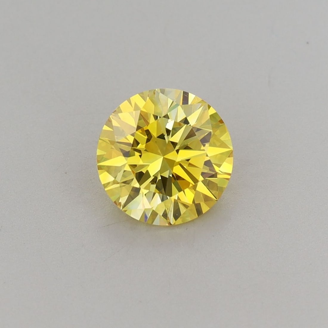 Loose Diamond - ROUND 1.06ct Fancy Vivid Yellow VVS2: Loose Diamond - ROUND 1.06ct Fancy Vivid Yellow VVS2 Source: This is a real non-mined Diamond that has been grown in a lab Shape: ROUND Carats: 1.06 Color: Fancy Vivid Yellow Certification: IGI Video: