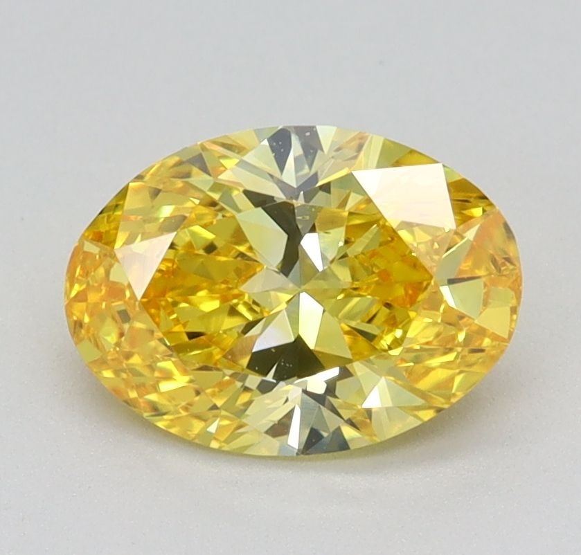 Loose Diamond - OVAL 0.94ct Fancy Vivid Yellow VVS2: Loose Diamond - OVAL 0.94ct Fancy Vivid Yellow VVS2 Source: This is a real non-mined Diamond that has been grown in a lab Shape: OVAL Carats: 0.94 Color: Fancy Vivid Yellow Certification: IGI Video: