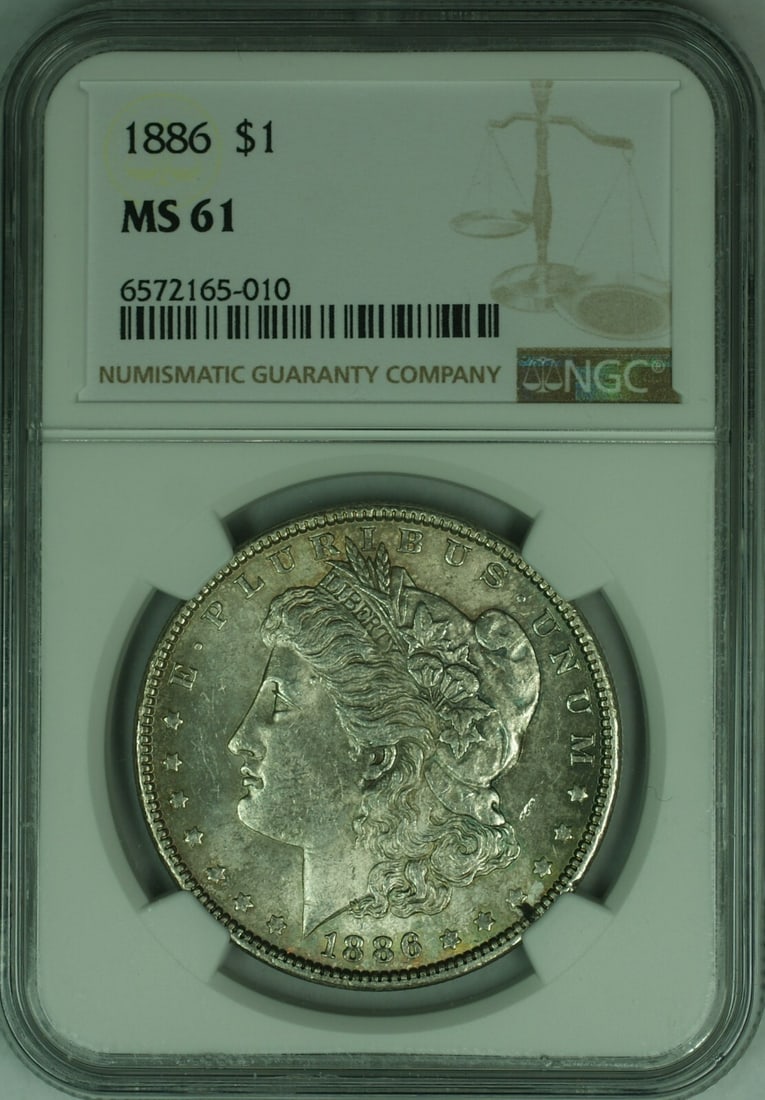 1886 Morgan Dollar Silver Coin NGC MS-61 with Light Toning: 1886 Morgan Dollar Silver Coin NGC MS-61 with Light Toning This is an 1886 Morgan Silver Dollar graded MS-61 by NGC, featuring light toning. Minted in Philadelphia, this uncirculated coin is composed