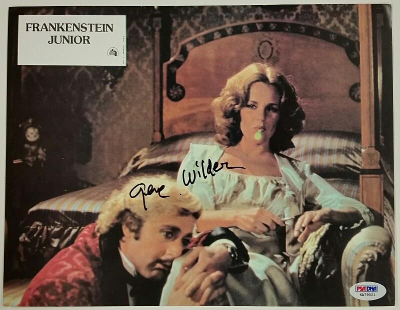 Gene Wilder Signed Young Frankenstein Lobby Card PSA/DNA COA: Gene Wilder Signed Young Frankenstein Lobby Card PSA/DNA COA This original lobby card features a vibrant image from the classic film 'Young Frankenstein,' signed by the legendary actor Gene Wilder. Th