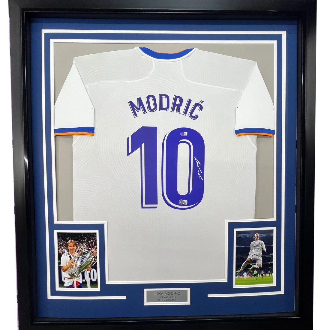 Framed Luka Modric Autographed Real Madrid Jersey Beckett COA 33x42: Framed Luka Modric Autographed Real Madrid Jersey Beckett COA 33x42 Celebrate your passion for soccer with this stunning framed autographed Luka Modric Real Madrid white jersey. The jersey is a genuin