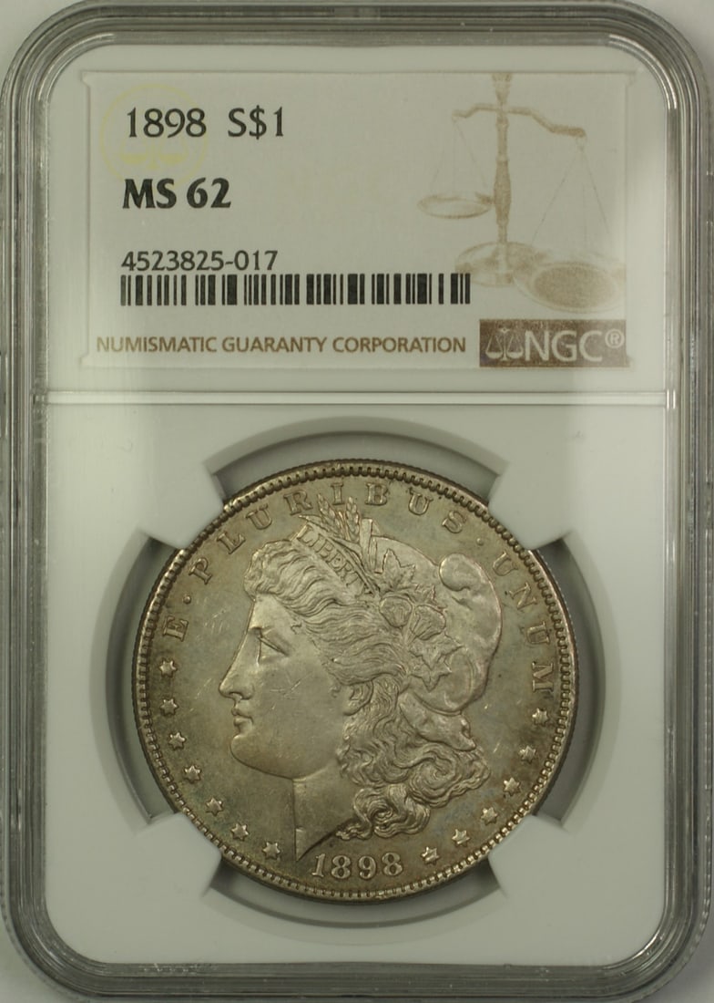 1898 $1 Morgan Dollar NGC MS62 Semi Proof-Like Toned Silver Coin: 1898 $1 Morgan Dollar NGC MS62 Semi Proof-Like Toned Silver Coin This is an 1898 Morgan Silver Dollar struck at the Philadelphia Mint. Certified by NGC with a grade of MS 62, this uncirculated coin fe