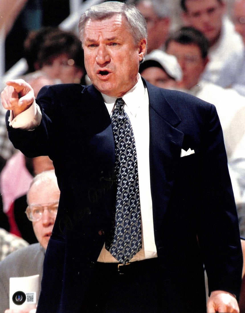 Dean Smith Autographed 11x14 Photo Beckett LOA North Carolina Legend: Dean Smith Autographed 11x14 Photo Beckett LOA North Carolina Legend This autographed 11x14 color photograph features North Carolina Coaching Legend Dean Smith, who passed away in 2015. The photograph
