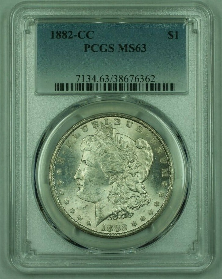 PCGS MS63 1882 Carson City Morgan Silver Dollar Light Toning: PCGS MS63 1882 Carson City Morgan Silver Dollar Light Toning This 1882-CC Morgan Silver Dollar is graded MS-63 by PCGS and features light toning. Minted at the Carson City Mint in the United States, t