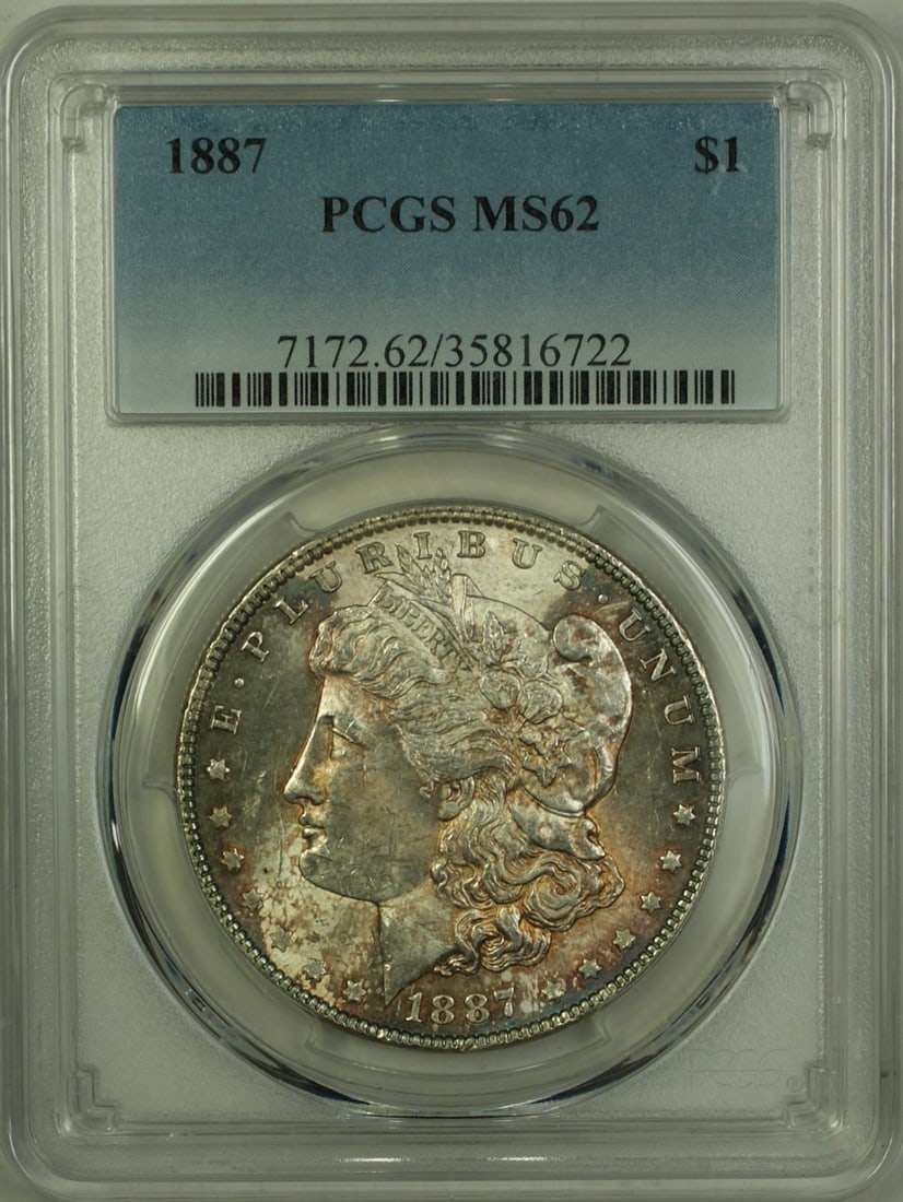 PCGS MS-62 1887 Morgan Dollar Silver Coin with Toned Obverse: PCGS MS-62 1887 Morgan Dollar Silver Coin with Toned Obverse This 1887 Morgan Silver Dollar features a toned obverse and is certified by PCGS with a grade of MS-62. Struck at the Philadelphia Mint, th