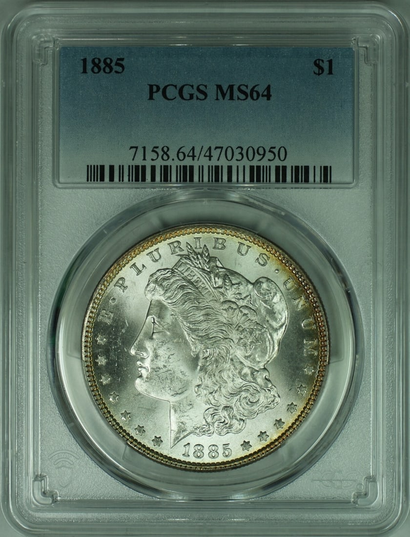 PCGS MS-64 Graded 1885 Morgan Dollar Silver Coin: PCGS MS-64 Graded 1885 Morgan Dollar Silver Coin This is an 1885 Morgan Silver Dollar graded MS-64 by PCGS. The coin is uncirculated and composed of 90% silver. It was minted in Philadelphia and is ce