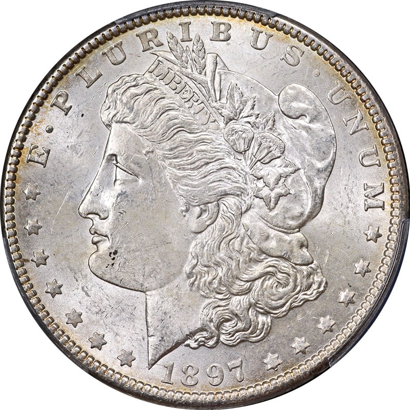 1897-P Morgan Silver Dollar PCGS MS63 Uncirculated Silver Coin: 1897-P Morgan Silver Dollar PCGS MS63 Uncirculated Silver Coin This 1897-P Morgan Silver Dollar is certified by PCGS with a grade of MS63, indicating its uncirculated condition. The coin features nice