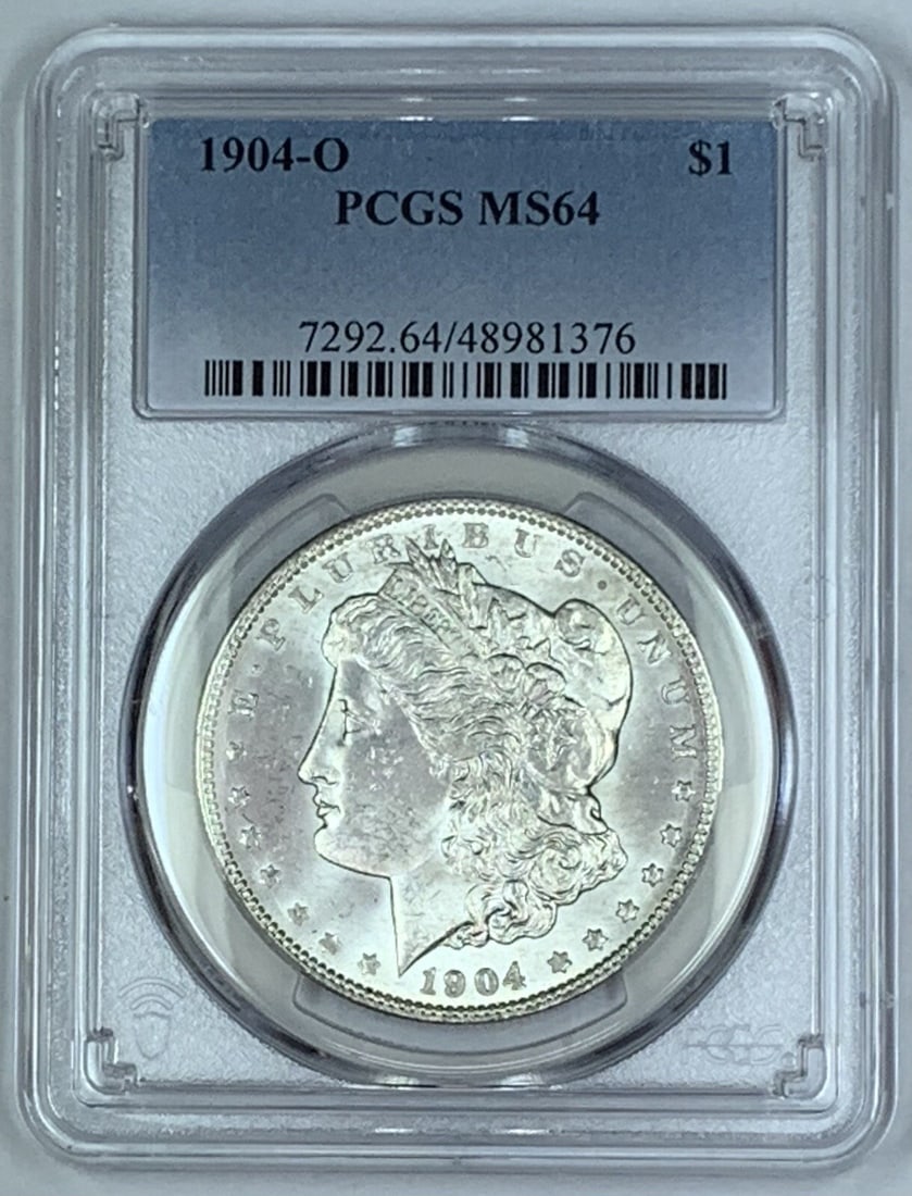PCGS MS 64 1904-O Morgan Silver Dollar Uncirculated US Coin: PCGS MS 64 1904-O Morgan Silver Dollar Uncirculated US Coin This 1904-O Morgan Silver Dollar is an un-used coin certified by PCGS with a grade of MS 64. Struck in silver, it features the classic Morga