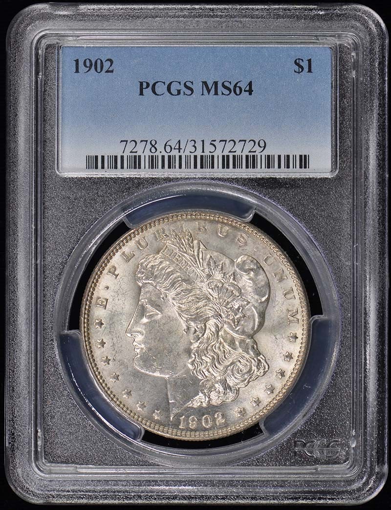 1902 Morgan Dollar PCGS MS64 Uncirculated Philadelphia Mint: 1902 Morgan Dollar PCGS MS64 Uncirculated Philadelphia Mint This 1902 Morgan Dollar is a stunning example of American coinage, certified by PCGS with a grade of MS64, indicating its uncirculated condi
