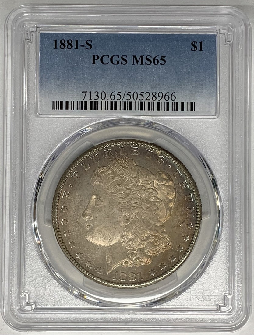 PCGS MS 65 1881-S Morgan Dollar Silver Coin With Attractive Toning: PCGS MS 65 1881-S Morgan Dollar Silver Coin With Attractive Toning This is an 1881-S Morgan Silver Dollar from the United States, featuring attractive toning. The coin is composed of silver, has a den
