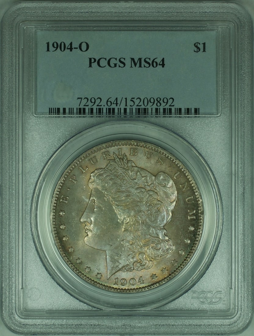 PCGS MS-64 1904-O Morgan Dollar New Orleans Silver with Light Grapefruit Purple Toning: PCGS MS-64 1904-O Morgan Dollar New Orleans Silver with Light Grapefruit Purple Toning This 1904-O Morgan Silver Dollar is certified by PCGS with a grade of MS-64. Minted in New Orleans, the coin feat