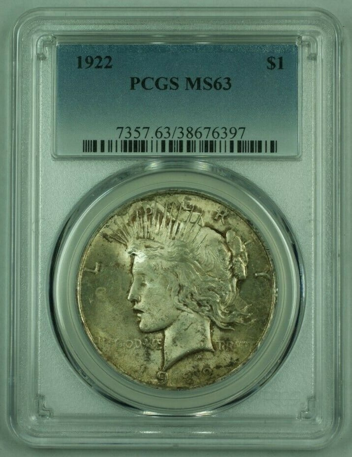 PCGS MS-63 1922 Peace Dollar Silver Toned Philadelphia Mint: PCGS MS-63 1922 Peace Dollar Silver Toned Philadelphia Mint This is a 1922 Peace Silver Dollar, graded MS-63 by PCGS. The coin is uncirculated, features attractive toning, and is noted as being very w