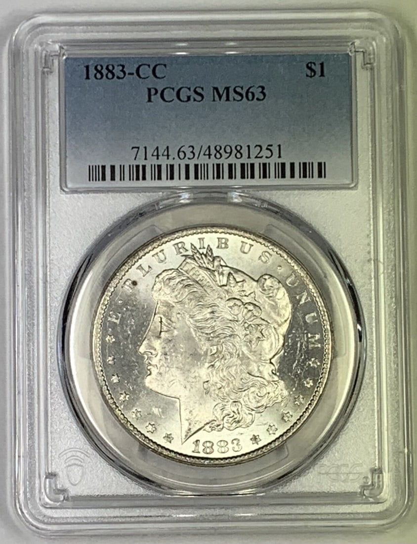 PCGS MS 63 1883 Carson City Morgan Silver Dollar: PCGS MS 63 1883 Carson City Morgan Silver Dollar This 1883-CC Morgan Silver Dollar is graded MS 63 by PCGS and was minted in Carson City. It is an uncirculated coin composed of silver and is pre-owned