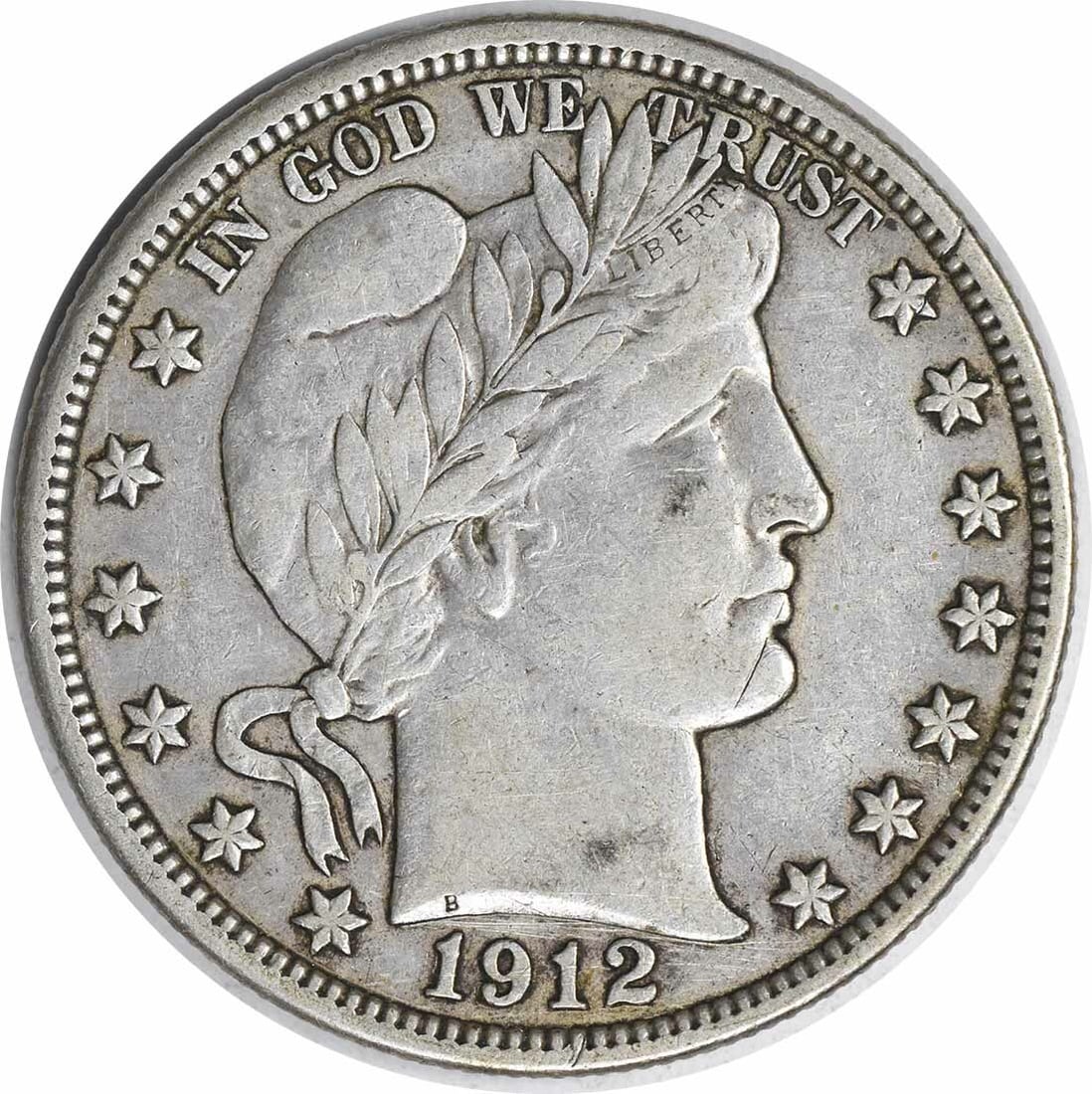 1912 Barber Silver Half Dollar VF Uncertified 50C Philadelphia Coin: 1912 Barber Silver Half Dollar VF Uncertified 50C Philadelphia Coin This 1912 Barber Silver Half Dollar showcases the intricate design by Charles E. Barber. With a denomination of 50 cents, this coin