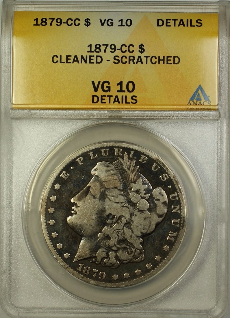 Carson City 1879-CC Morgan Silver Dollar ANACS VG-10 Details Cleaned Scratched: Carson City 1879-CC Morgan Silver Dollar ANACS VG-10 Details Cleaned Scratched This is an 1879-CC Morgan Silver Dollar, certified by ANACS with a grade of VG-10 Details. The coin was minted in Carson
