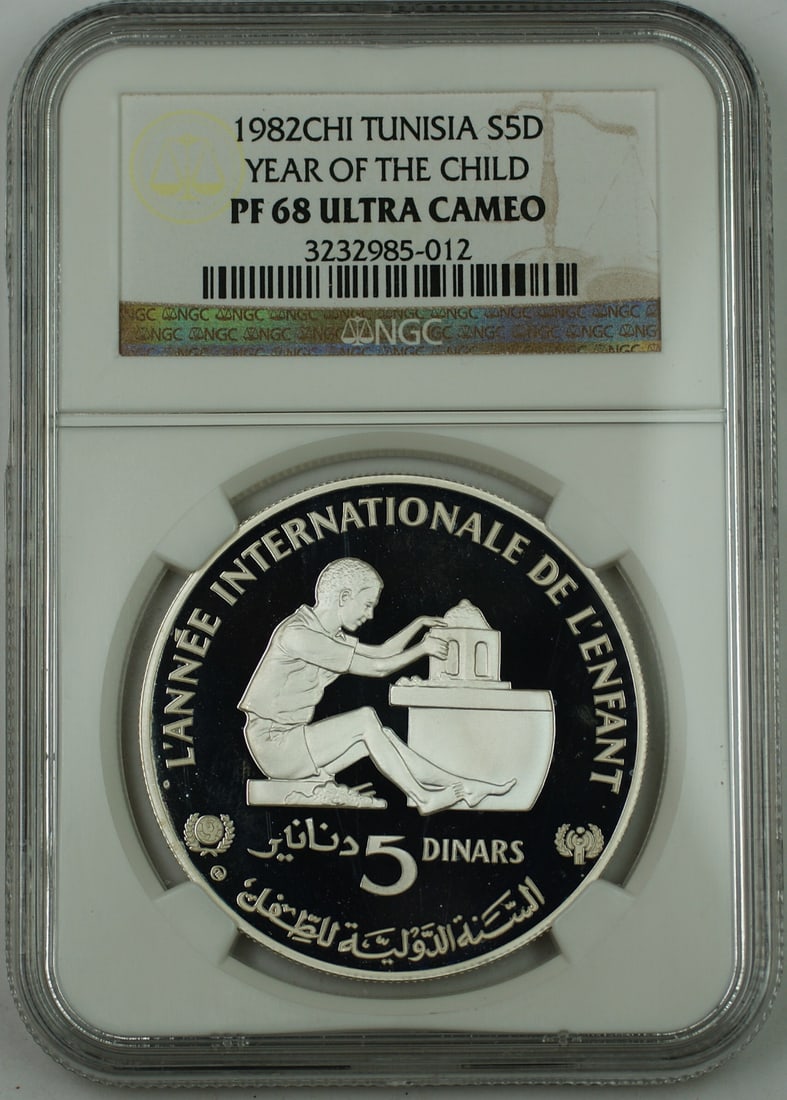 NGC PF-68 Ultra Cameo 1982 Tunisia 5 Dinars Silver Proof Year of the Child: NGC PF-68 Ultra Cameo 1982 Tunisia 5 Dinars Silver Proof Year of the Child This 1982 Tunisia 5 Dinars proof coin is struck in 0.925 fine silver to commemorate the International Year of the Child. Mint