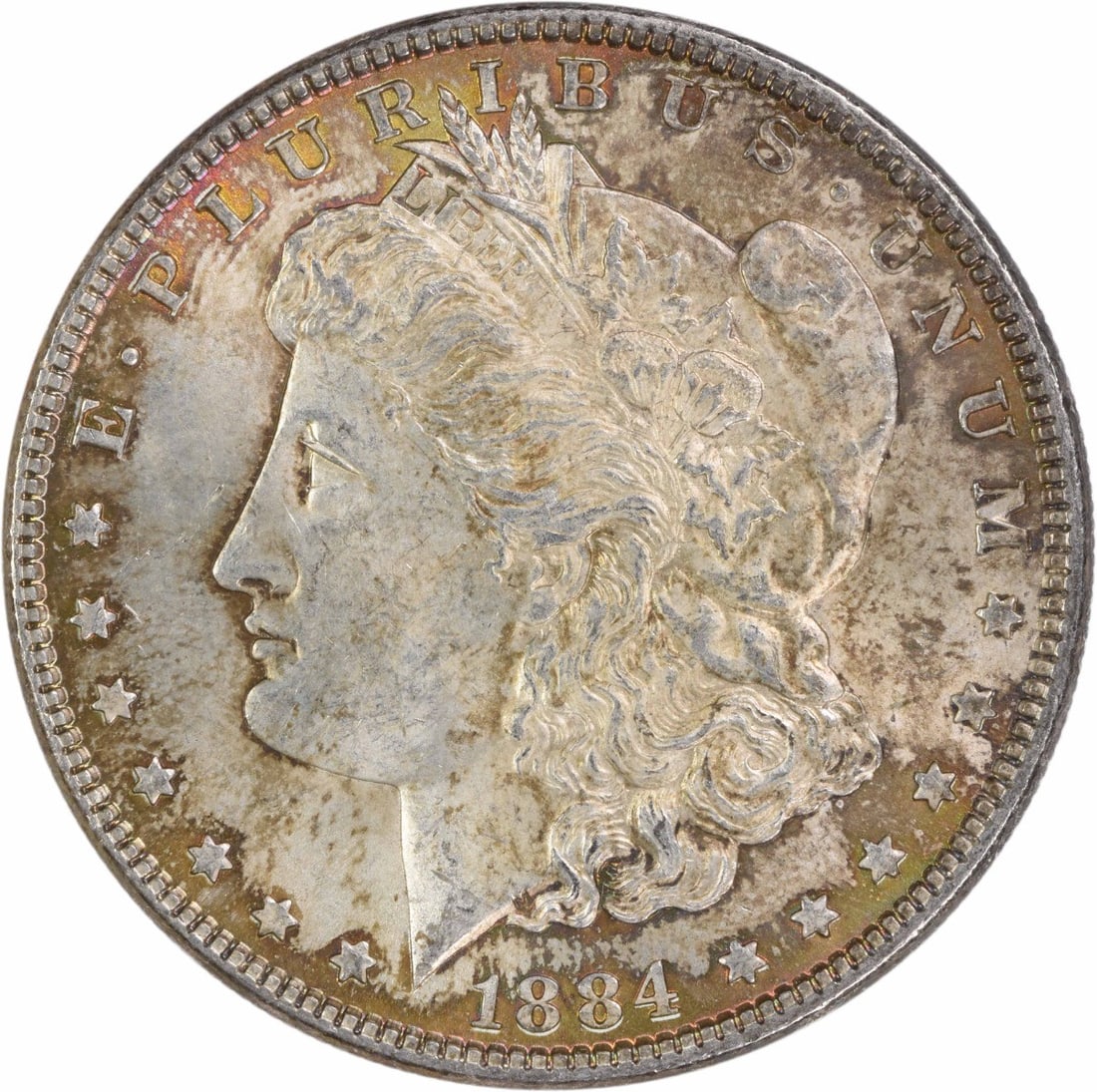 1884 Morgan Silver Dollar Choice BU Uncertified Toned: 1884 Morgan Silver Dollar Choice BU Uncertified Toned This 1884 Morgan Silver Dollar is a stunning piece in Choice Brilliant Uncirculated (BU) condition. The coin showcases a beautiful silver composit