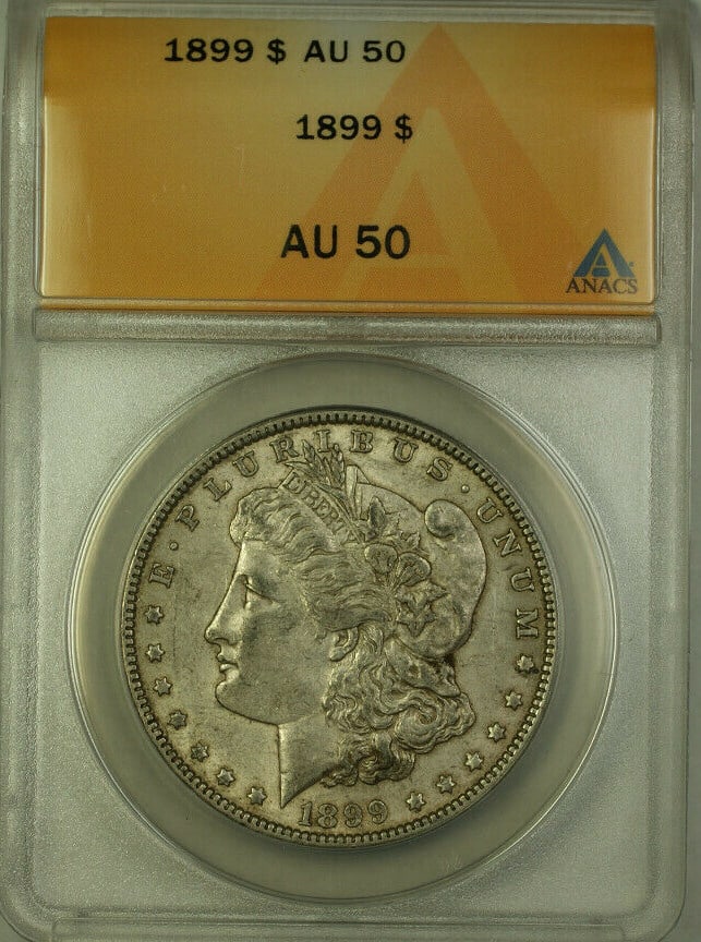 ANACS AU 50 1899 Silver Morgan Dollar Coin Philadelphia Mint: ANACS AU 50 1899 Silver Morgan Dollar Coin Philadelphia Mint This is an 1899 Morgan Silver Dollar graded AU 50 by ANACS and minted in Philadelphia. The coin is composed of silver, remains un-used, and