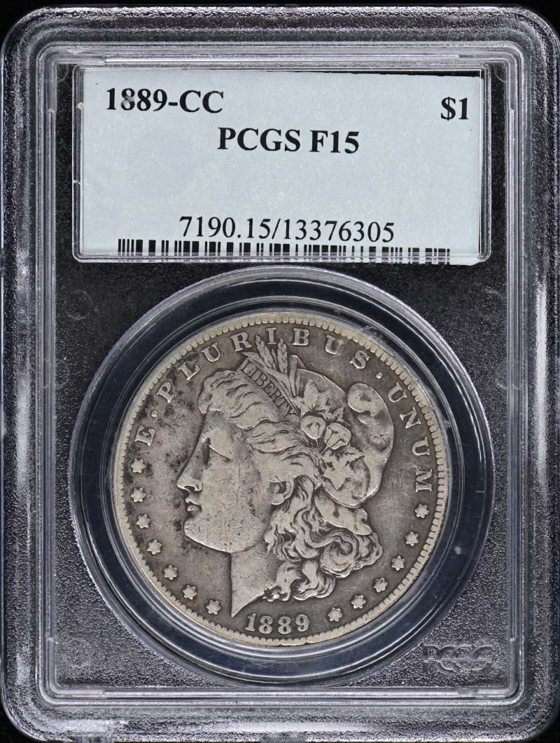 1889 Carson City Morgan Dollar $1 PCGS F15 Certified: 1889 Carson City Morgan Dollar $1 PCGS F15 Certified This 1889-CC Morgan Dollar is certified by PCGS with a grade of F15, indicating it has been circulated but remains in good condition. Struck at the