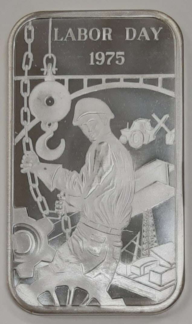 Labor Day 1975 One Troy Oz 999 Silver Bar By Madison Mint: Labor Day 1975 One Troy Oz 999 Silver Bar By Madison Mint This Madison Mint commemorative bar is crafted from .999 fine silver and weighs 1 troy ounce. Issued to celebrate Labor Day 1975, it remains i