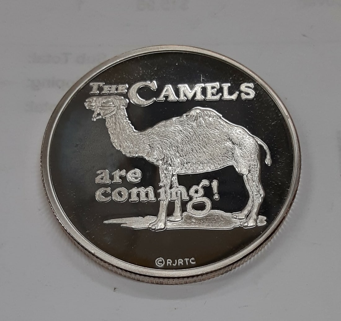 Commemorative Camels Are Coming 1 oz Silver Round Proof-Like Finish: Commemorative Camels Are Coming 1 oz Silver Round Proof-Like Finish This R.J. Reynolds Tobacco Company commemorative silver round features the "Camels Are Coming" theme. Struck in 1 oz of fine silver,